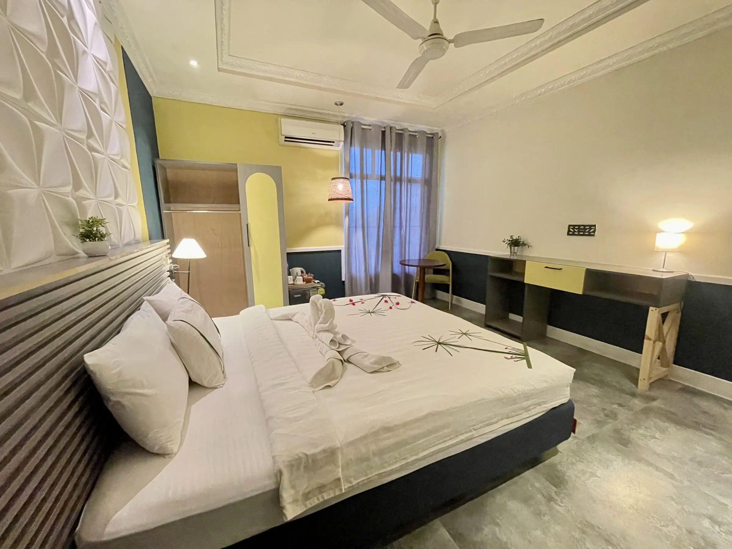 Comfortable double room in neutral tones at Koimala Maamigili